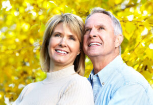 happy senior couple implant dentistry concept