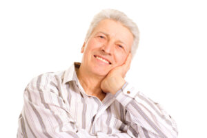 senior man smiling implant dentistry concept