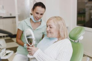 https://www.pexels.com/photo/smiling-patient-at-dentist-5622014/ smiling patient